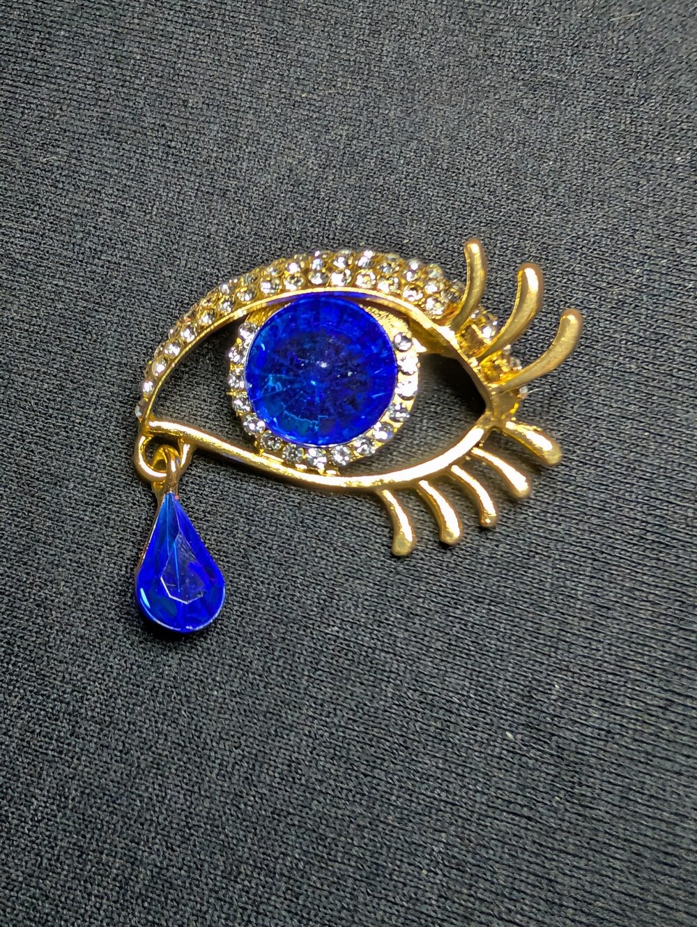 Gold Eye Brooch with Blue Crystal Tear